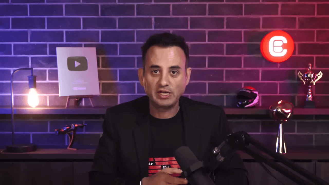 video host speaking directly to camera on a studio set about macro indicators