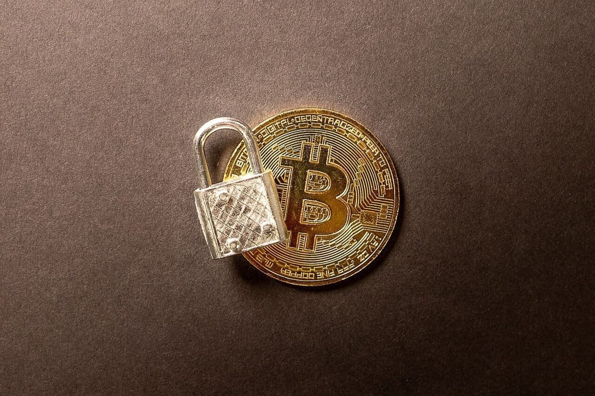 Padlock resting on a bitcoin coin