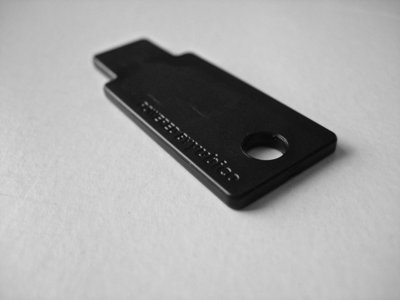 Black YubiKey-style USB-A security key (item type photo)