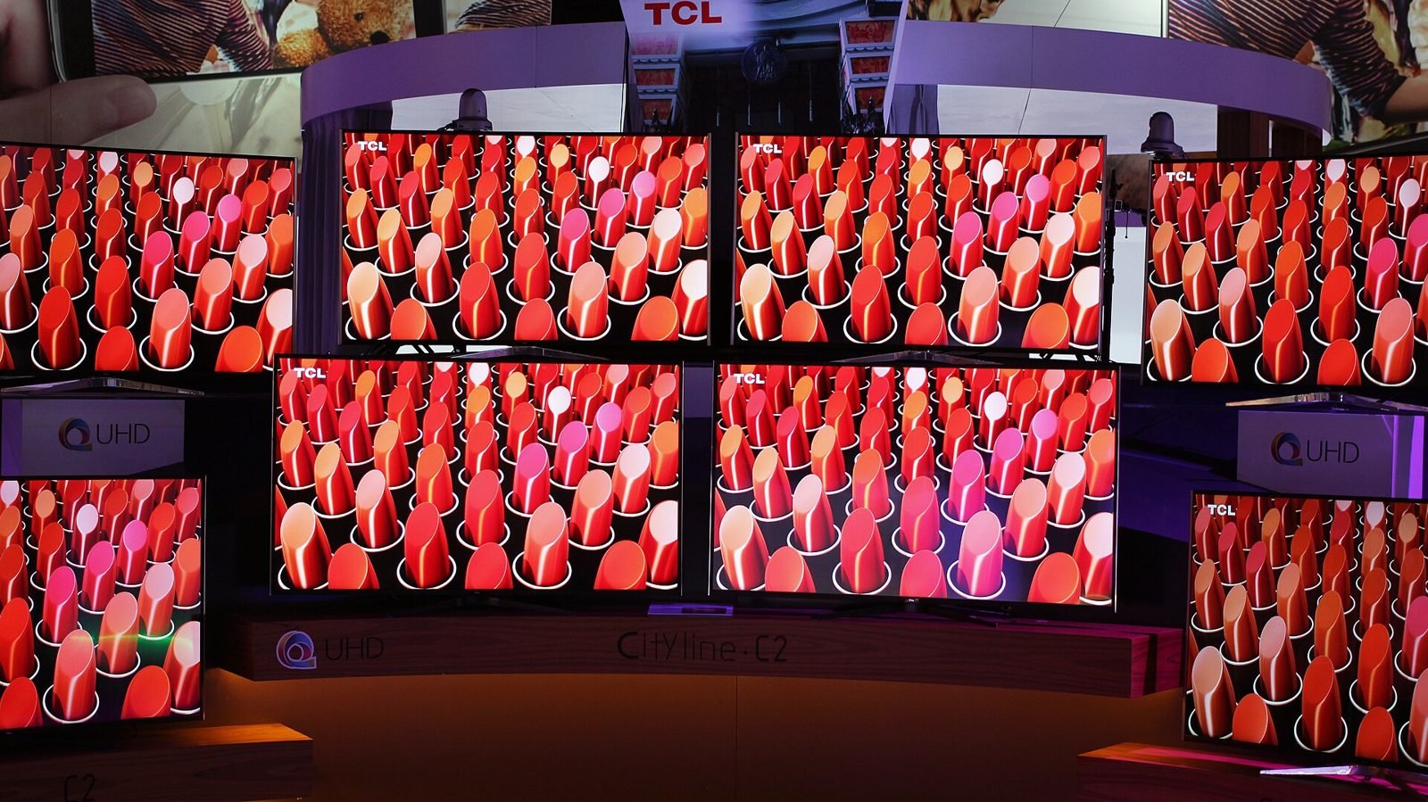 Wall of TCL 4K televisions on display (item type photo)