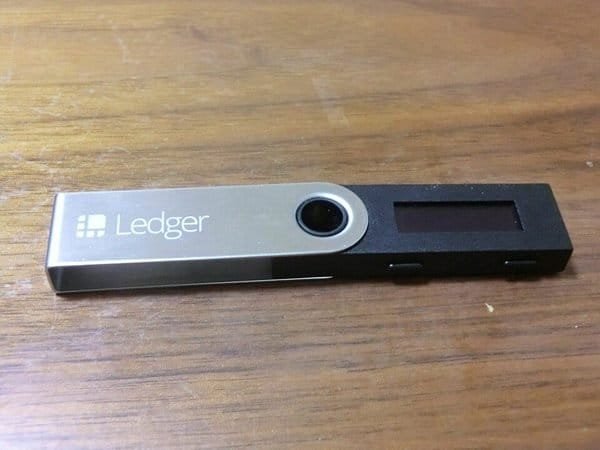USB stick-style crypto hardware wallet (item type photo, not the exact product)