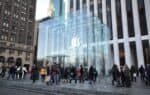Shoppers outside the glass cube entrance of Apple's Fifth Avenue store in New York